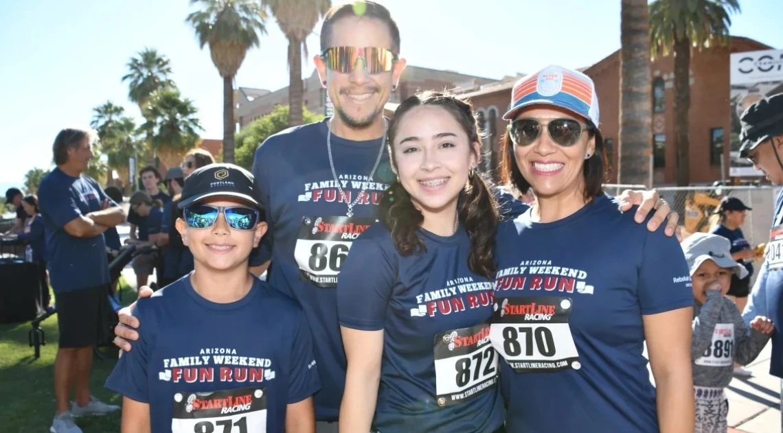 Family on the university of arizona campus celebrating Family Weekend